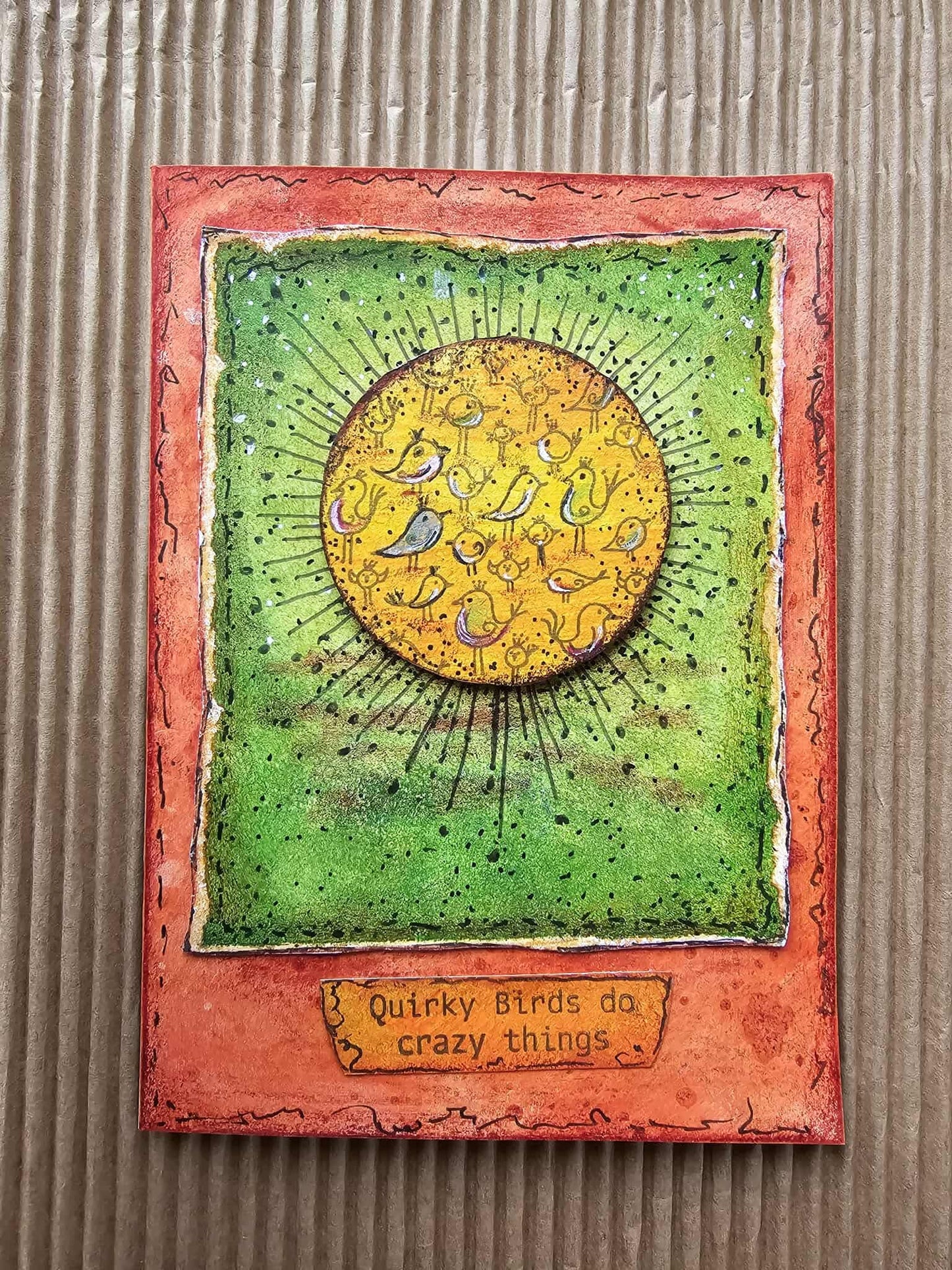 Decorative card with a sun design and text on a textured surface