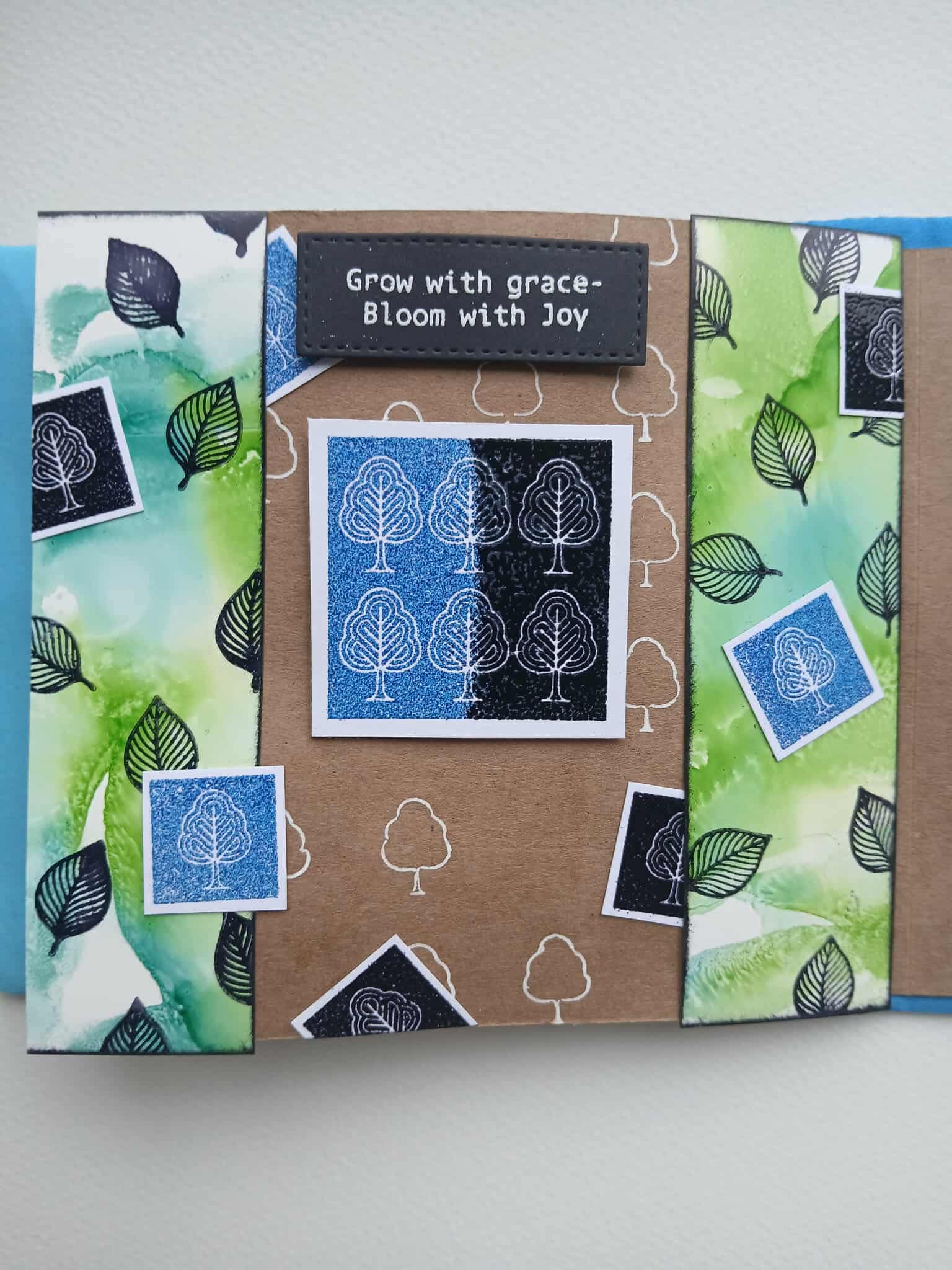 Handmade card with tree design and 'Grow with grace, Bloom with joy' text on a white background