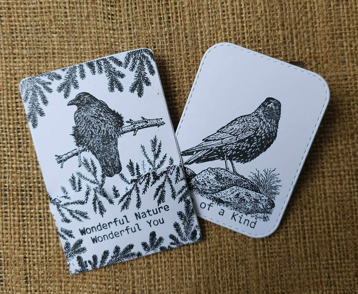 Two cards with bird illustrations and text on a textured brown background