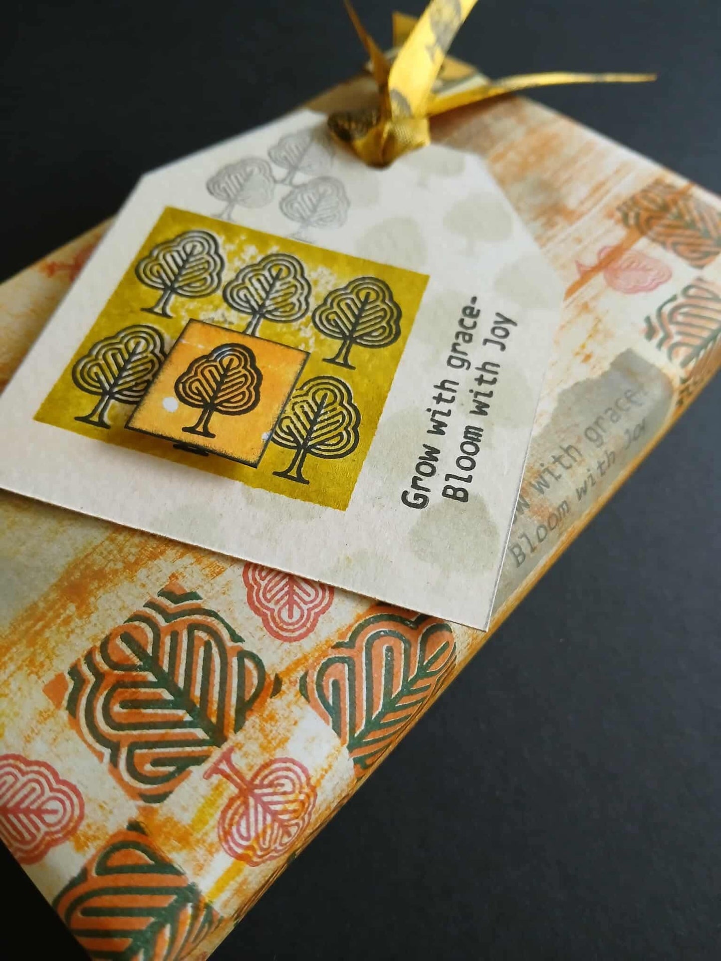 Gift tag with tree design and text on a textured surface