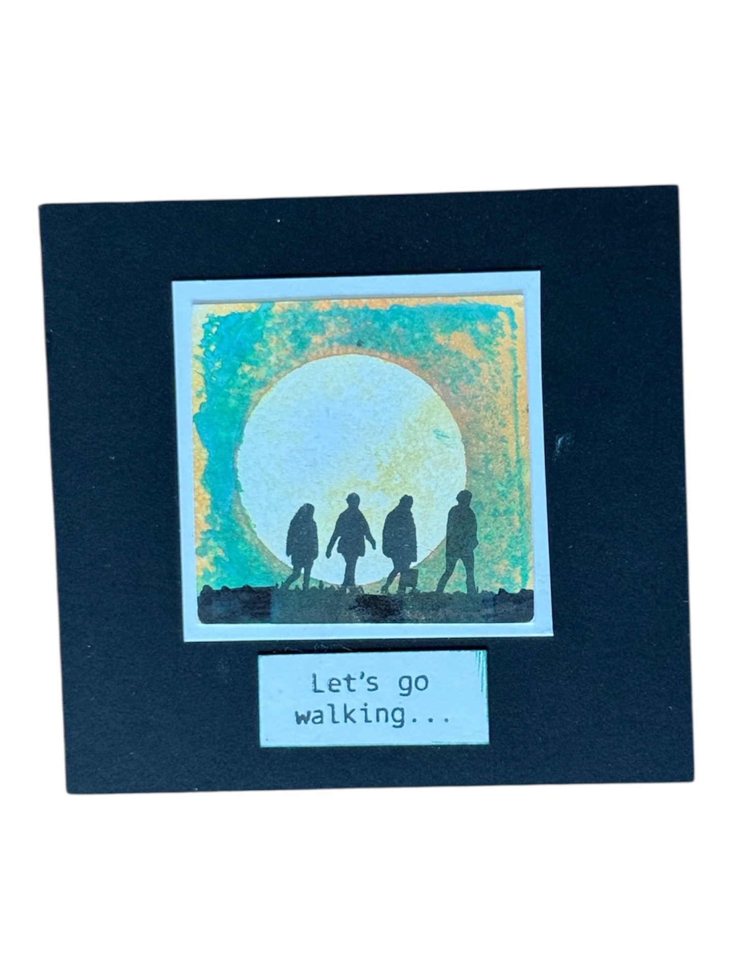 people walking together into the sun