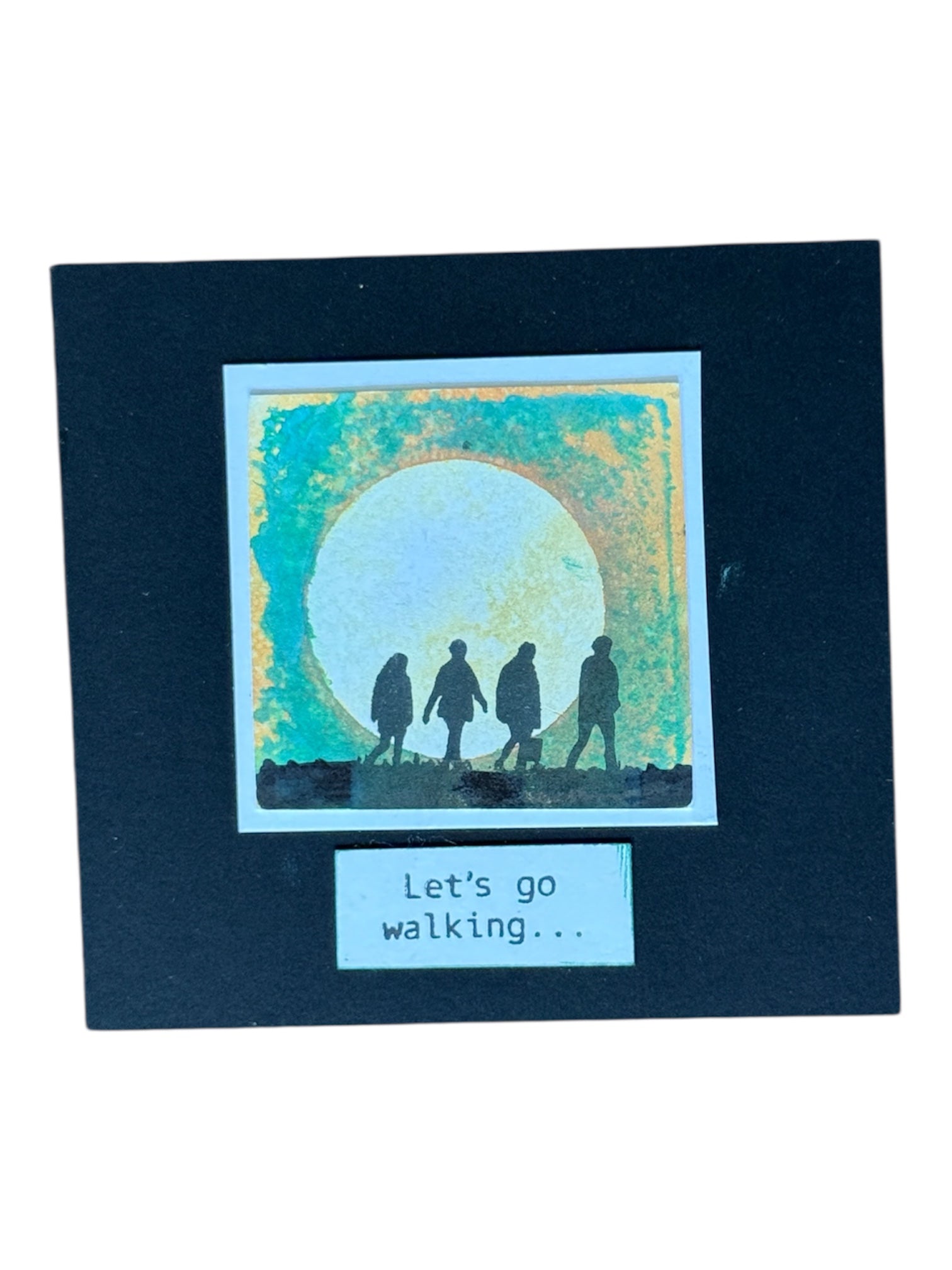 people walking together into the sun