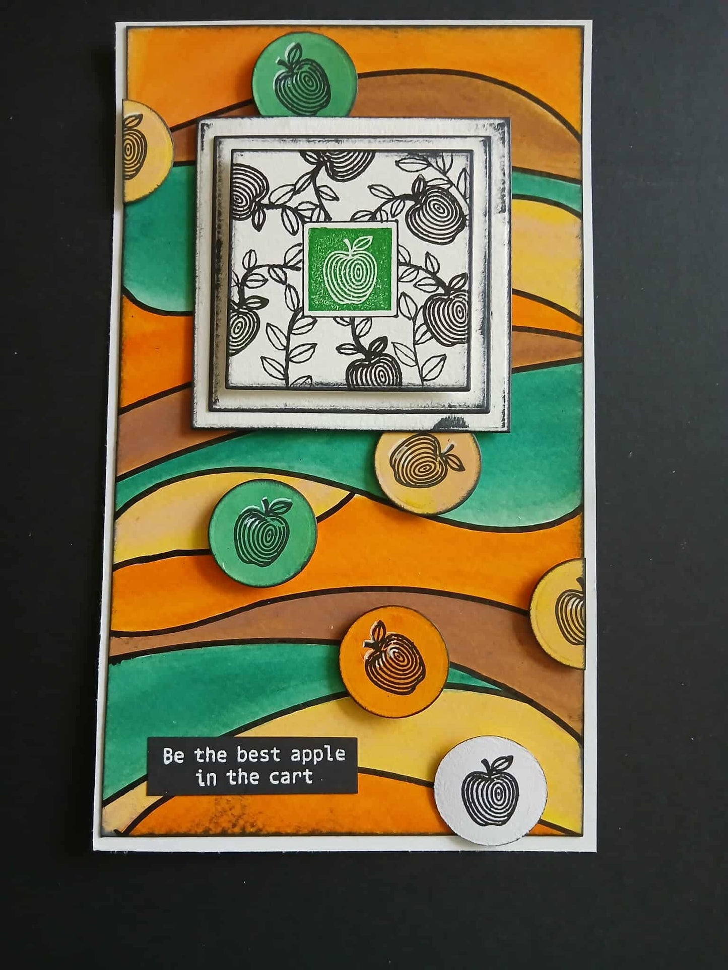 Decorative card with apple-themed design and text on a black background