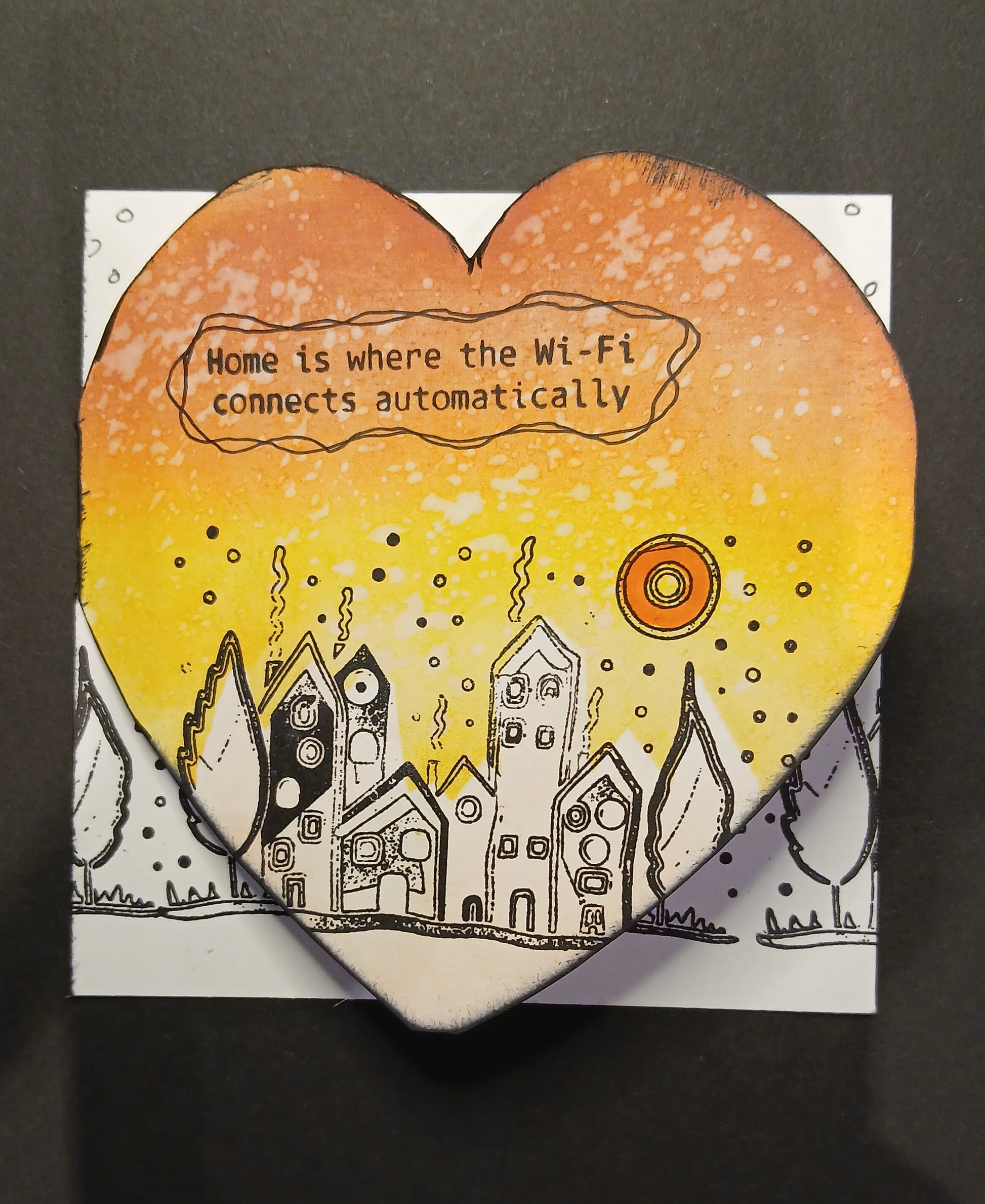 Heart-shaped card with a cityscape illustration and text on a dark background