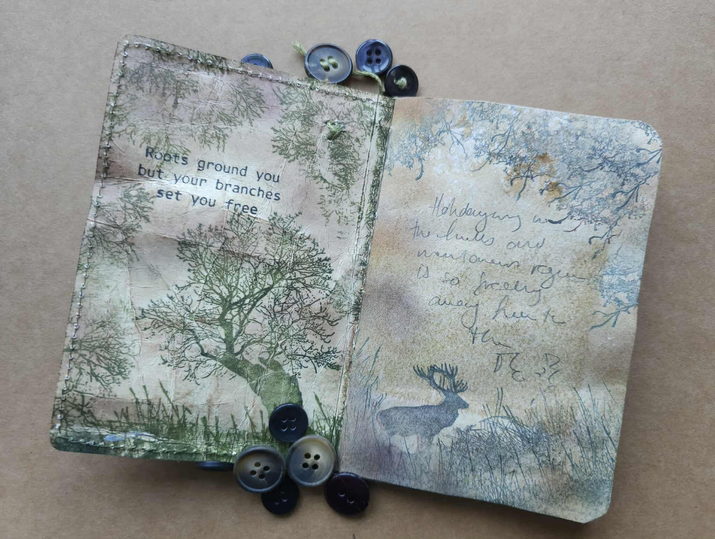 Two textured cards with nature-themed designs and buttons on a beige background