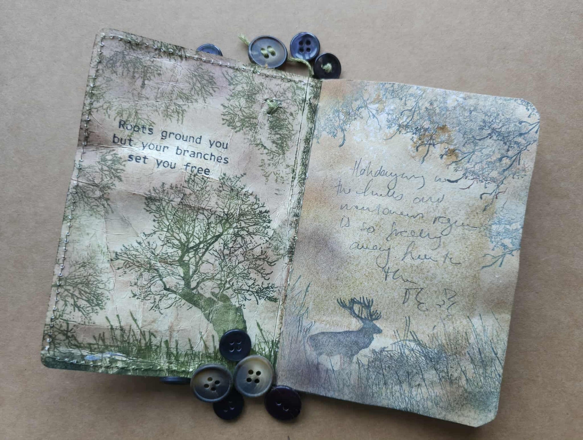 Two textured cards with nature-themed designs and buttons on a beige background