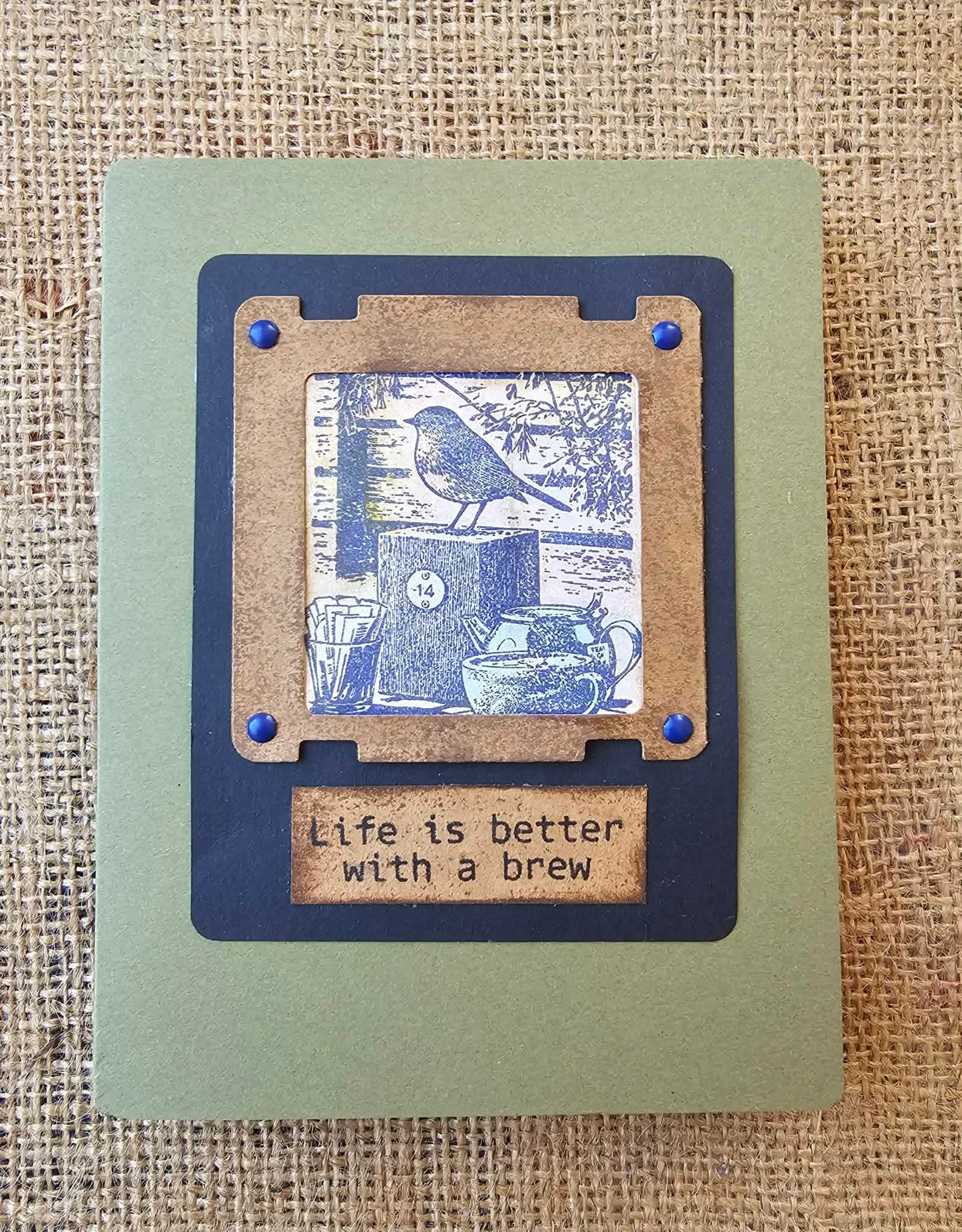 Card with a blue and brown design featuring a bird and text on a textured background