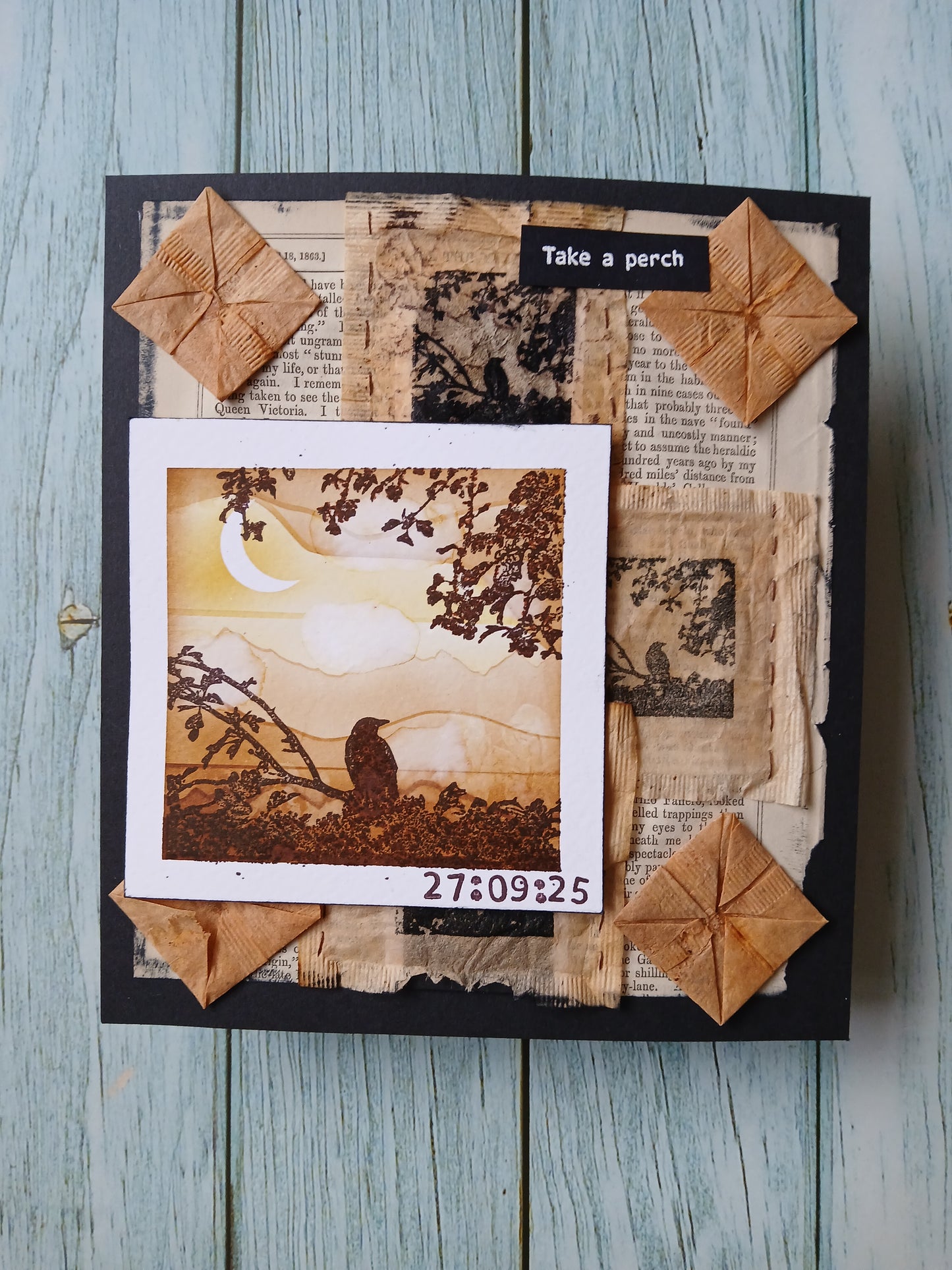 Decorative frame with textured paper and a central photo on a wooden surface