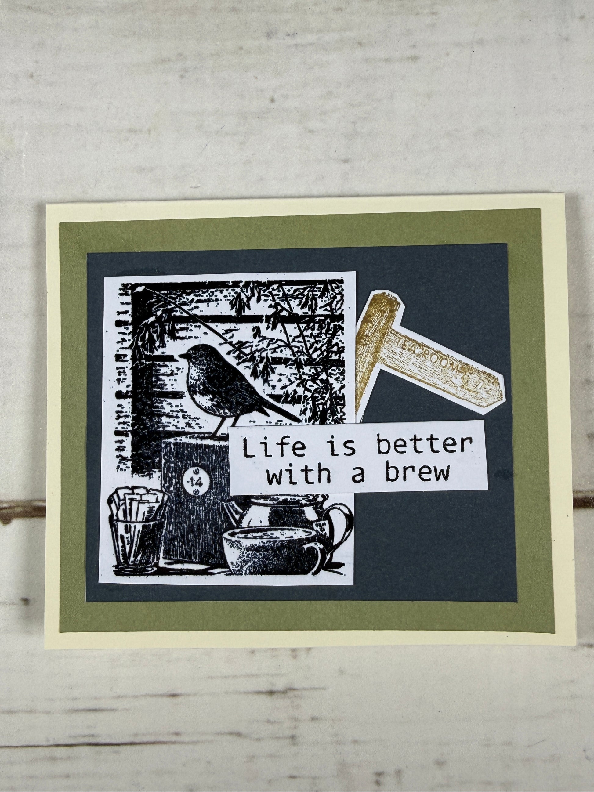 Greeting card with 'Life is better with a brew' text and coffee-themed design on a textured surface.