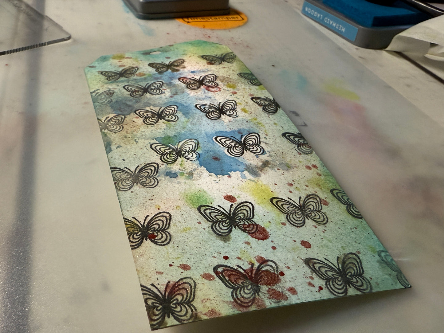 Card with butterfly design on a textured surface