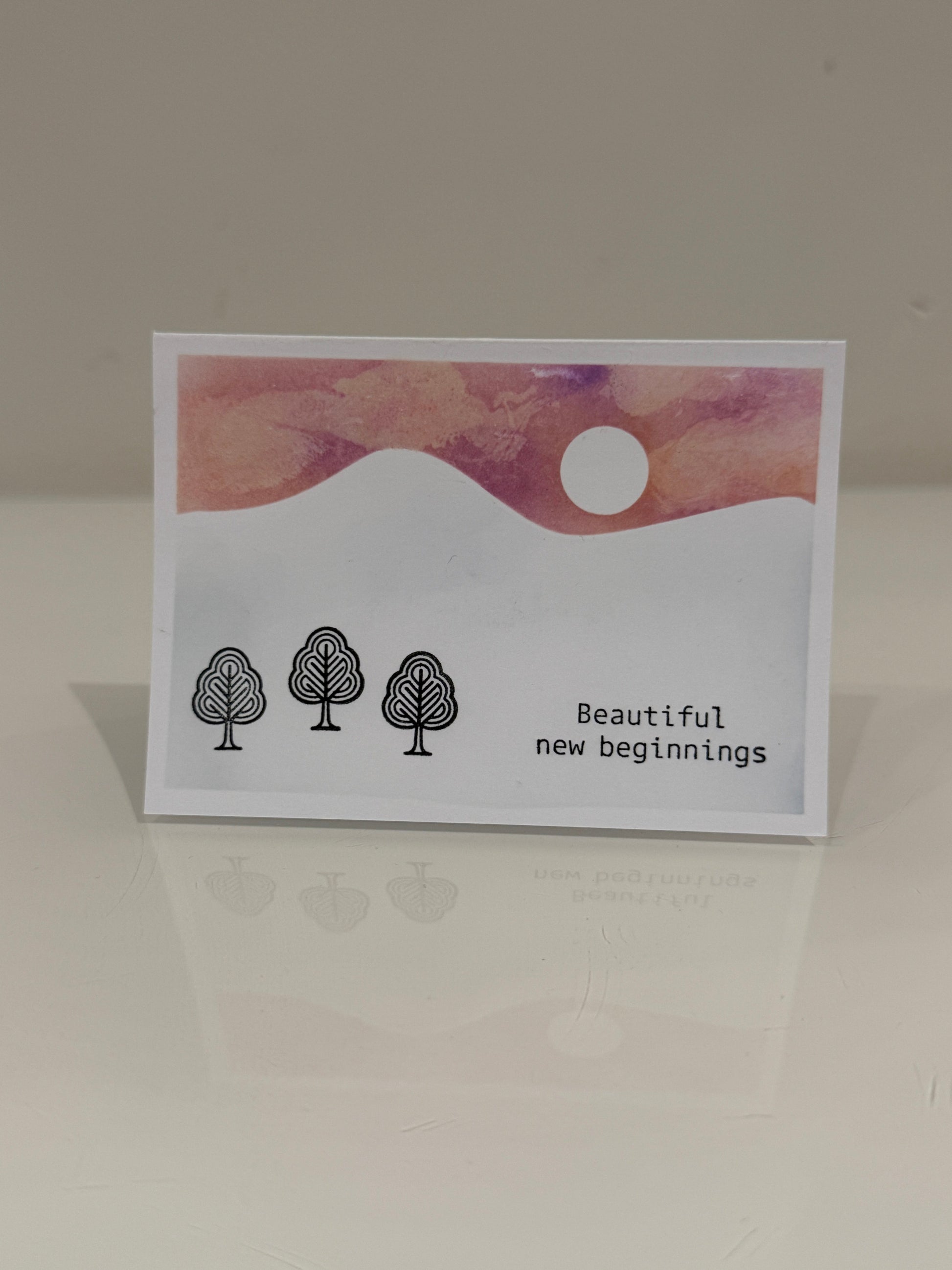 Greeting card with abstract design and text on a plain background