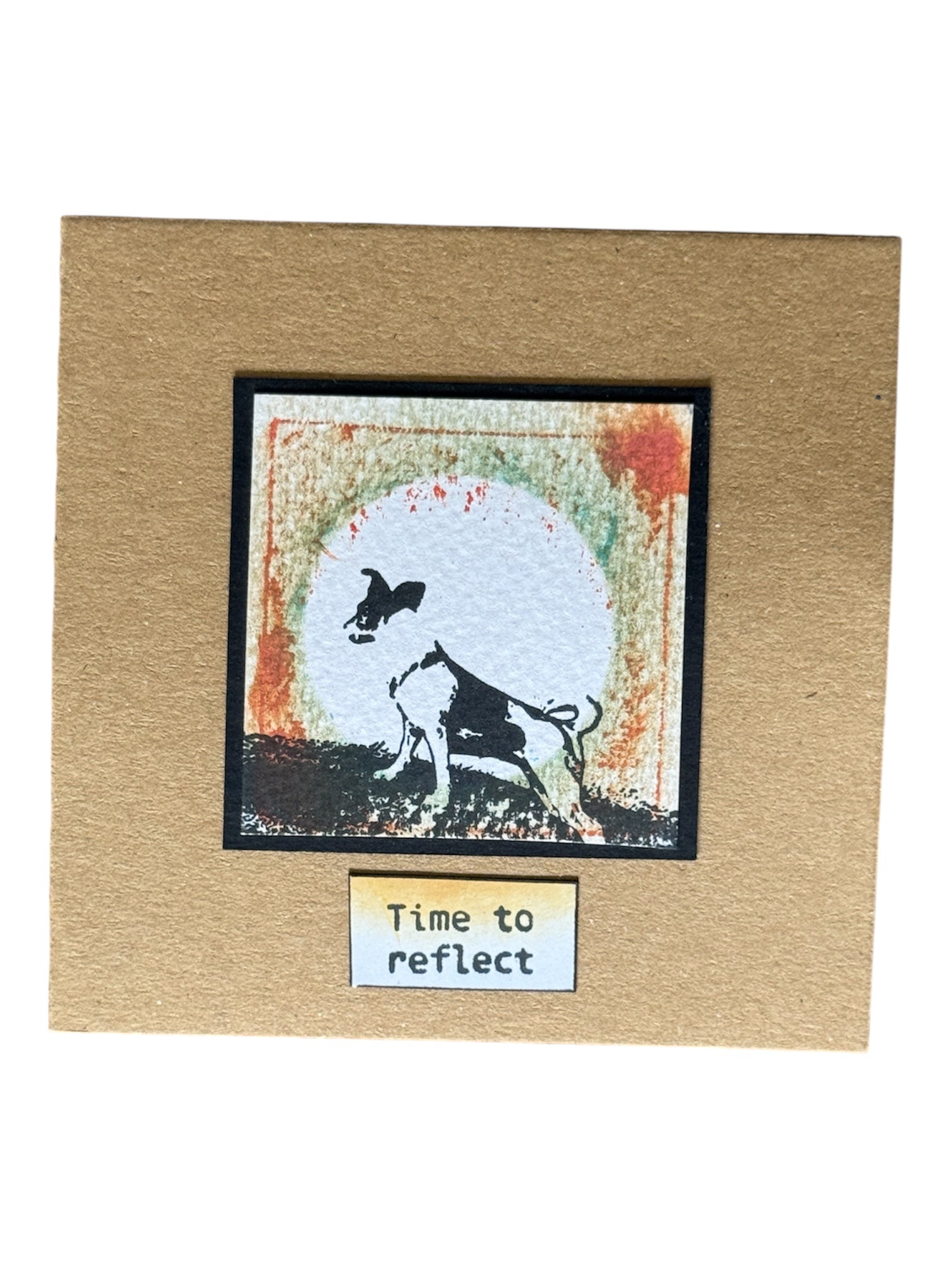 Dog on a hill with the moon